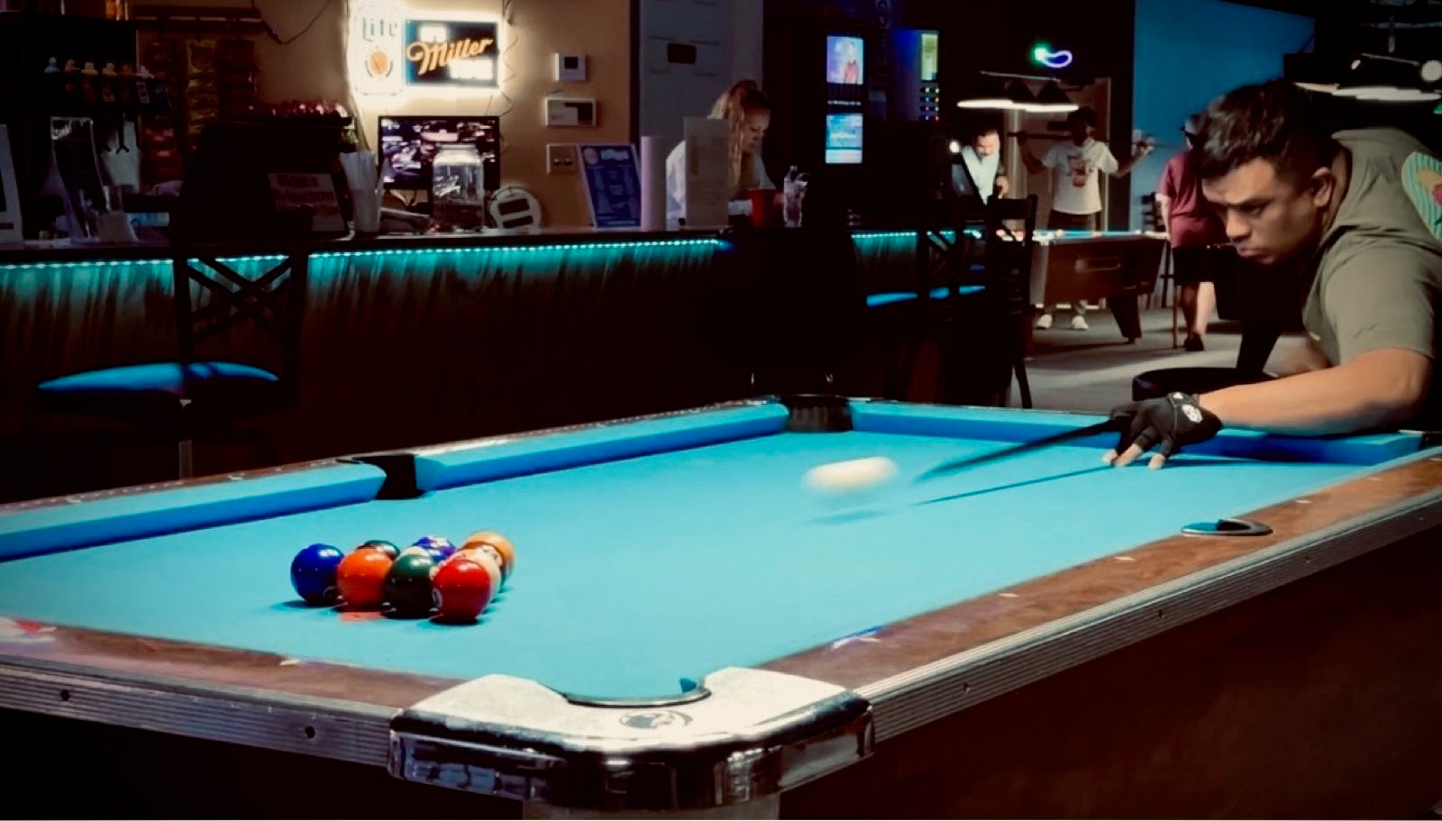 A NAPA of Pensacola player breaking the rack at Nine Mile Billiards